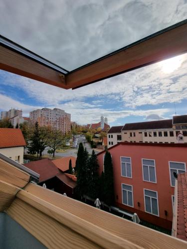 a view of a city from a window at Pensiunea Korona and Restaurant in Miercurea-Ciuc