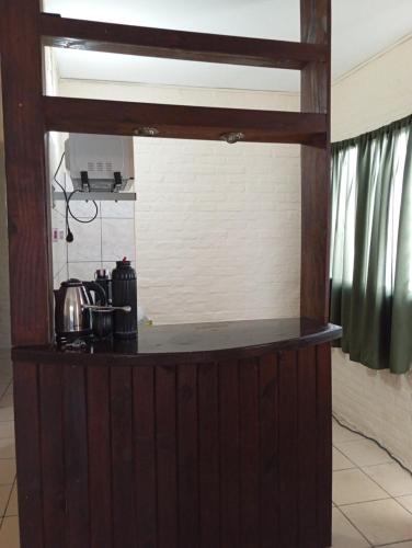 a kitchen with a counter in a room at CG ALQUILERES in Tacuarembó