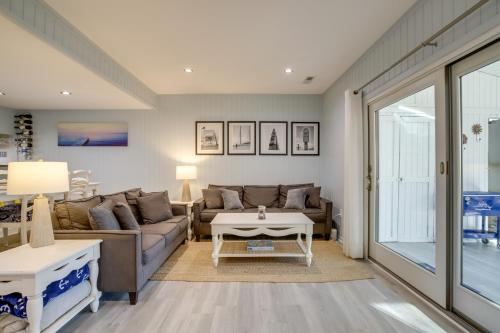a living room with a couch and a table at 1 Mi to Bethany Beach Townhome with Screened Porch! in Bethany Beach