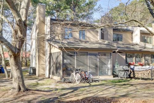 a house with bikes parked in front of it at 1 Mi to Bethany Beach Townhome with Screened Porch! in Bethany Beach