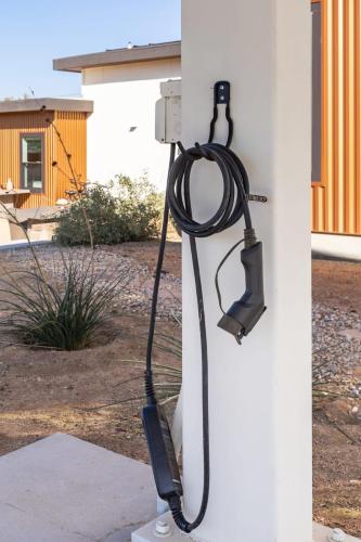a hose hooked up to a wall with a meter at Desert Contemporary Compound - Large Modern Oasis in Joshua Tree