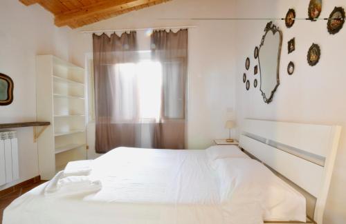 Ένα ή περισσότερα κρεβάτια σε δωμάτιο στο Elorina Casa Vacanze Birri sul mare Vendicari Noto