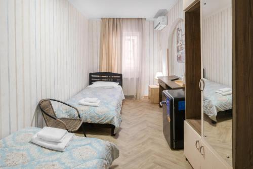 Postel nebo postele na pokoji v ubytování Lotus Hotel