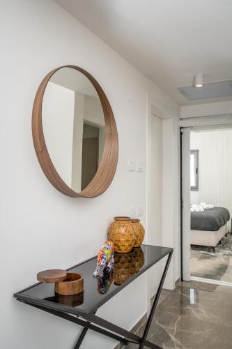 a room with a mirror and a glass table at Unique Masterpiece in the Heart of Jerusalem in Jerusalem