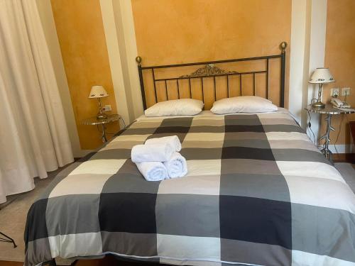 Ένα ή περισσότερα κρεβάτια σε δωμάτιο στο Πανσιόν Ιζαμπώ