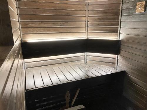 an empty sauna with a pair of scissors in it at Tahkonloft in Tahkovuori