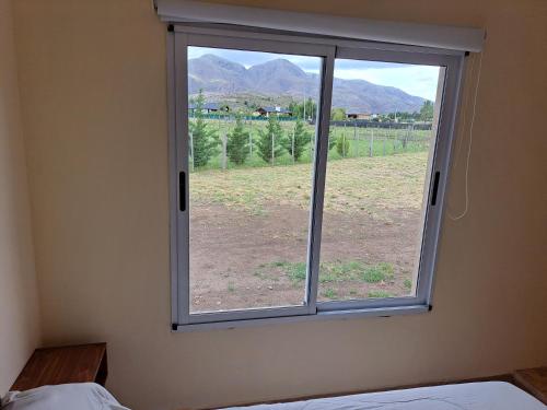 a window in a room with a view of a field at Buena Vista in San Andres de las Sierras