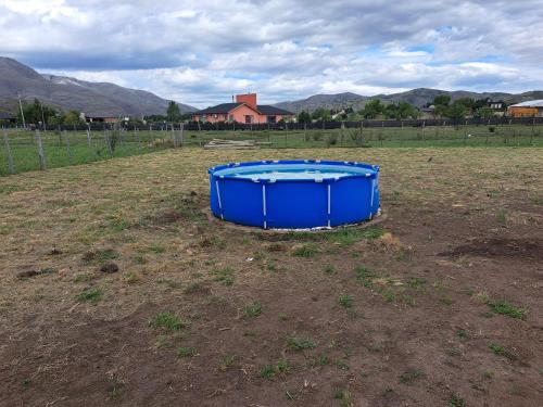 a blue tub sitting in the middle of a field at Buena Vista in San Andres de las Sierras