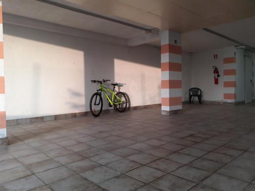a bike is parked in a large room at B&B La Verbena in Siena