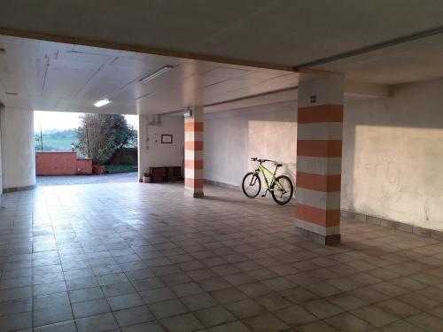 a bike parked in an empty parking garage at B&B La Verbena in Siena