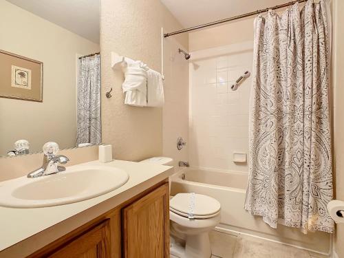 a bathroom with a sink and a toilet and a shower at Old Town Retreat At Regal Oaks By Mid Florida Home Management in Orlando