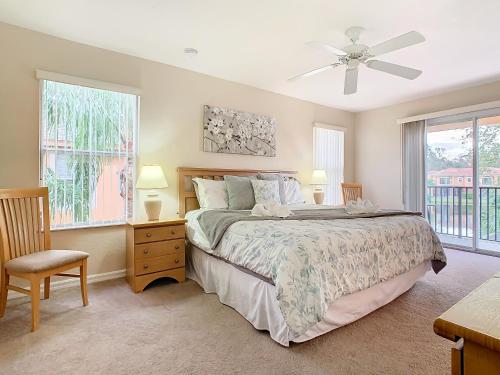a bedroom with a bed and a ceiling fan at Old Town Retreat At Regal Oaks By Mid Florida Home Management in Orlando