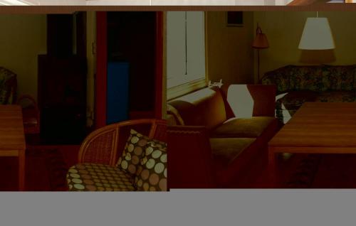 a living room with a couch and a chair at Nice Home In Olofström With Sauna in Olofström