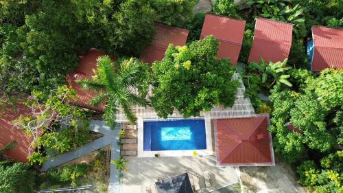 an overhead view of a house with a swimming pool at Villas In Sueño Private Jungle Hotel in Manuel Antonio