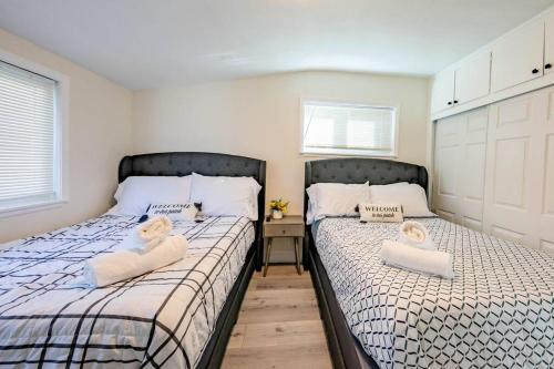 two beds sitting next to each other in a bedroom at Quiet & Peaceful Home Close to LA/Beaches/Disney in Rosemead