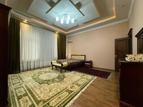 a living room with a bed and a rug at Bray Relax Home in Farsala