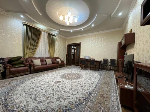 a living room with a couch and a table at Bray Relax Home in Farsala