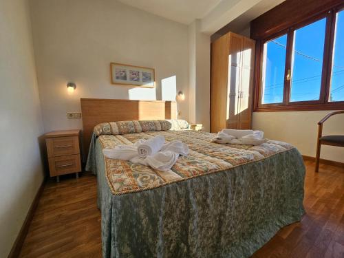 Postel nebo postele na pokoji v ubytování 17C01 Apartamento Caravia