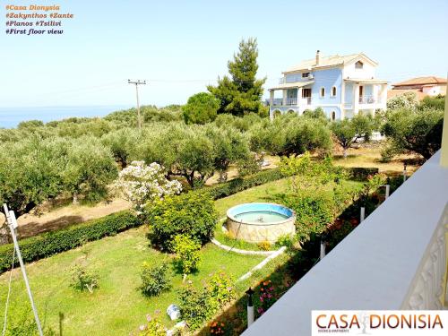 a view of a garden from the balcony of a house at Casa Dyonisia Tsilivi in Plános
