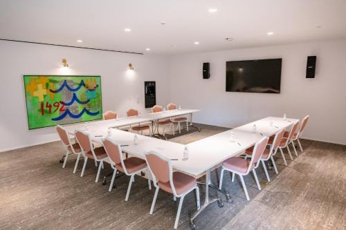 a conference room with a long table and chairs at The Doyle Hotel in Charlottesville