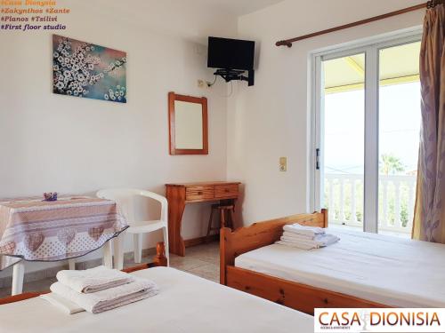 Posteľ alebo postele v izbe v ubytovaní Casa Dyonisia Tsilivi