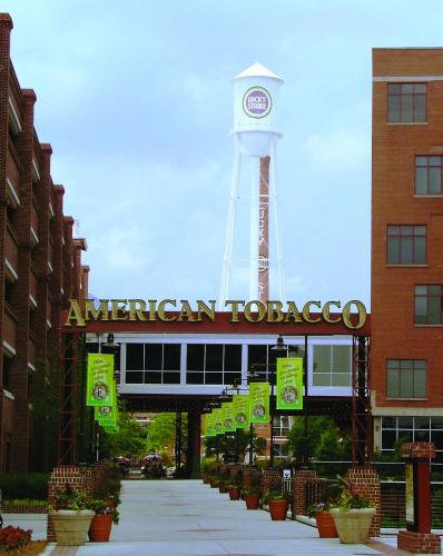 a tower with a clock on top of a building at University Inn Duke in Durham