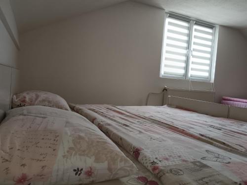 Katil atau katil-katil dalam bilik di Kuća za odmor