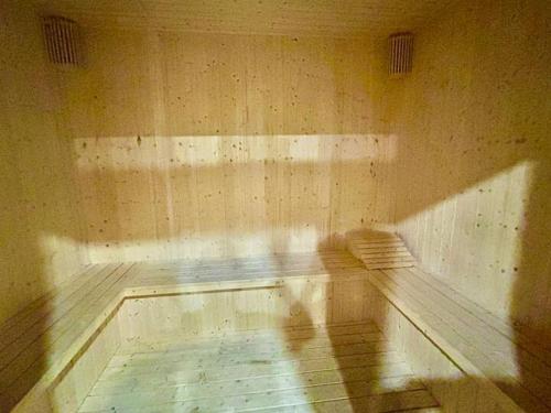 an empty room with a bench in the corner at SS KL Sentral by NomadNest in Kuala Lumpur