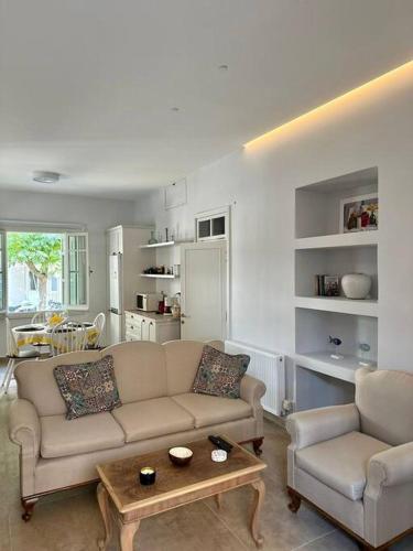 a living room with a couch and a table at Casa al Centro, Kos old town in Kos Town