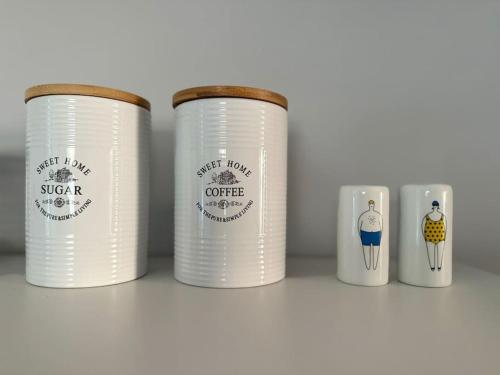 a row of white coffee cups on a shelf at Casa al Centro, Kos old town in Kos Town