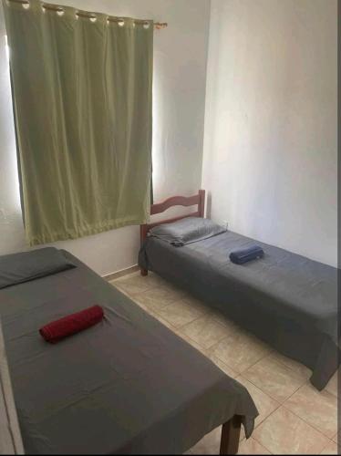 En eller flere senge i et værelse på Casa Cabo Frio - Praia do Foguete