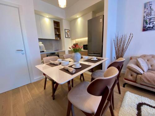 a kitchen and living room with a table and chairs at Bray Relax Home 3 in Farsala