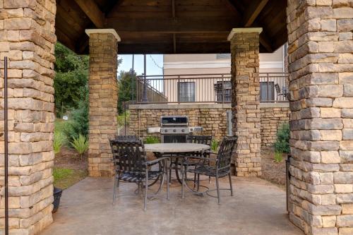 a patio with a table and chairs and a stove at Staybridge Suites Tallahassee I-10 East by IHG in Tallahassee