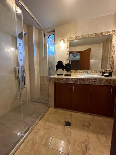 a bathroom with a shower and a sink at Villa Nero in Kokkini Khanion