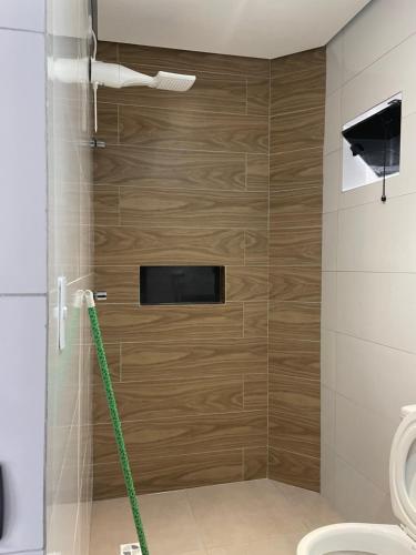 a bathroom with a shower with a hose at Hotel Max Tatuapé in Sao Paulo