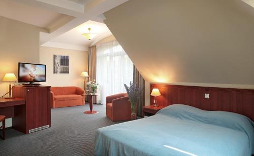 מיטה או מיטות בחדר ב-Hotel Promenada