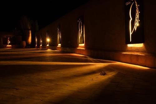 an empty street at night with lights on it at Eden Boutique Hotel in Tamellalt