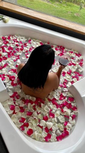 a bird sitting in a tray filled with hearts at Nalanda SPA & Casa de Montaña in Patate