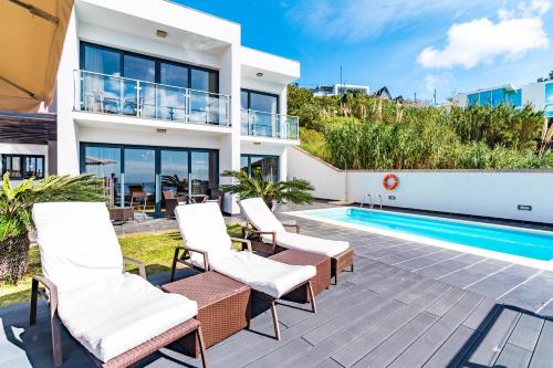 an image of a villa with a swimming pool at Villa Alex,pool and ocean view in Calheta