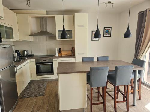 a kitchen with a table and chairs in it at Apartment Marbella in Dubrovnik