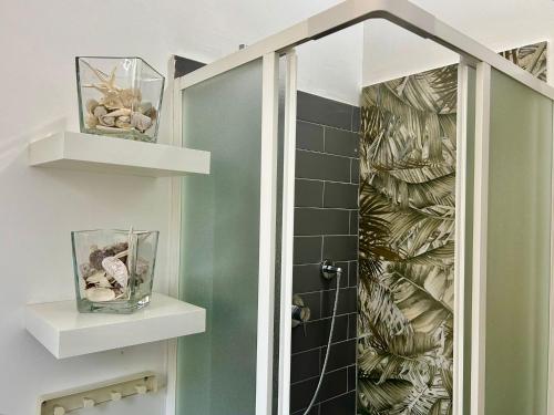 a bathroom with a shower with a glass door at Santhry House in Turin