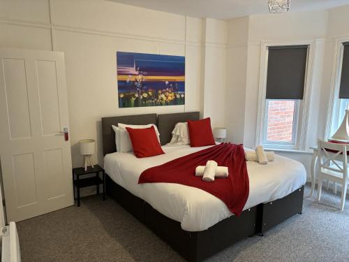a bedroom with a bed with two teddy bears on it at Urban Heights, Central BH1 in Bournemouth