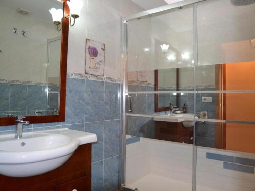 a bathroom with a glass shower and a sink at Casa con Piscina, Cerca de la Playa y del Centro - L'Estartit - ES-323-32 in L'Estartit