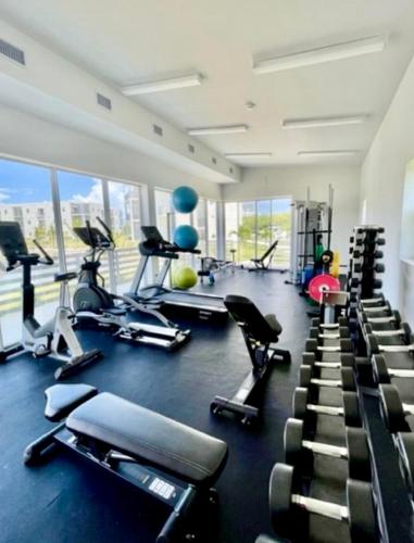a gym with a bunch of treadmills and machines at 19 North Apt 323 in West Bay