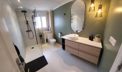 a bathroom with a sink and a mirror at Casa Miro in Ciudad Quesada