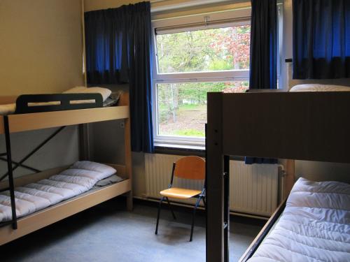 Postel nebo postele na pokoji v ubytování Harba Lorifa