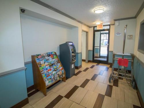 a waiting room with a atm machine in a store at Sweet Dream Inn - University Park in Pensacola
