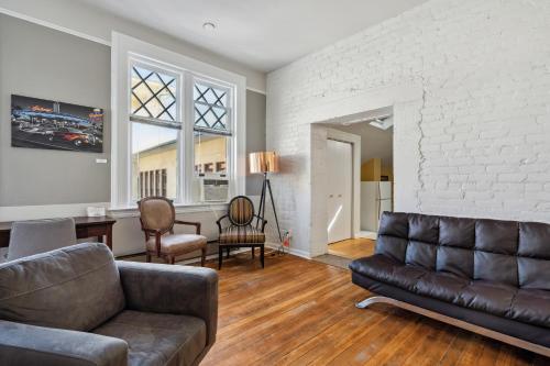 a living room with a couch and a chair at THE CARRICK in Bisbee