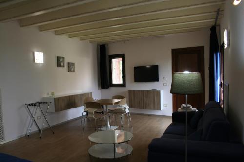 a living room with a couch and a table at Bamboo Luxury B&B in Agrigento