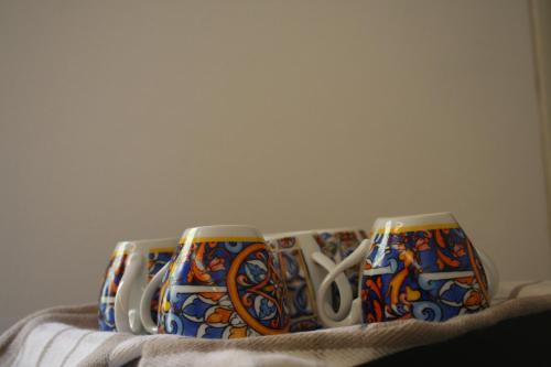 two cups sitting on top of a blanket at Bamboo Luxury B&B in Agrigento